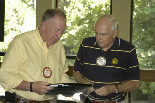 Ralph Russell awards Rusty Warner his Paul Harris Fellow.JPG