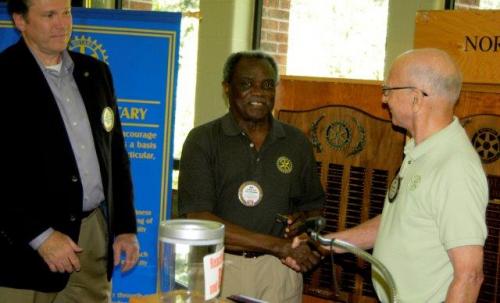 Jim Norman last year's Foundation Chair congradulates Nat of his 7 time Paul Harris pin.jpg