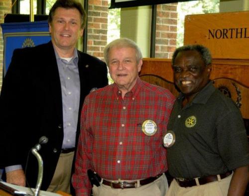 Nat Nwizu Northlake's Foundation Chair gives George Spencer his 6 times Paul Harris pin.jpg